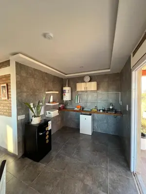 a kitchen with a counter and a counter top at Terraza de Amancay in Villa Amancay