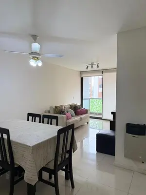 a dining room with a table and chairs and a couch at Reggia house in Cordoba