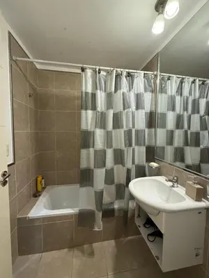 a bathroom with a tub and a sink and a bath tub at Reggia house in Cordoba