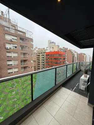 a balcony with a view of a city with buildings at Reggia house in Cordoba