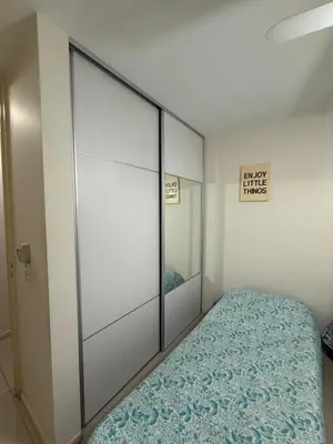 a bedroom with a bed and a large sliding door at Reggia house in Cordoba