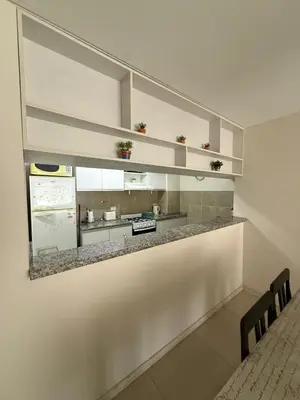 a kitchen with a counter in a room at Reggia house in Cordoba