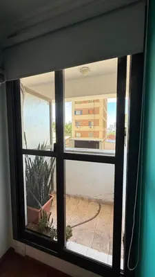 a window with a view of a building at Jacaranda apart in Cordoba