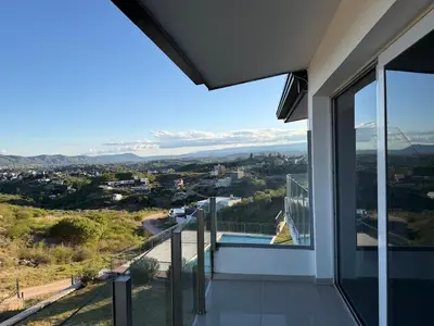a view from the balcony of a house at Departamento Carilo Carlos Paz in Villa Carlos Paz
