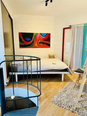 a room with two bunk beds and a painting on the wall at Encantador departamento en Güemes in Cordoba