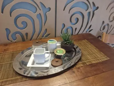 a tray with a plate of food on a table at Estudio en Nueva Córdoba in Cordoba