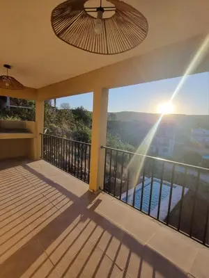 a balcony of a house with a view of the water at Casa de Tanti in Tanti