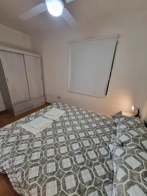 a bedroom with a bed and a white board at Casa de Tanti in Tanti
