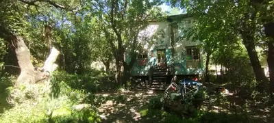 a house in the middle of a forest at NATURAL Tanti Lomas in Tanti