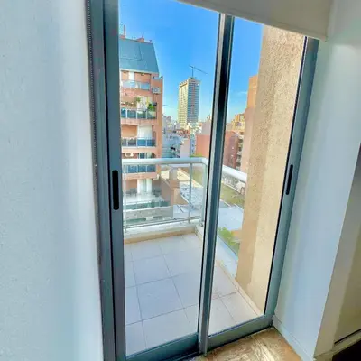 a sliding glass door with a view of a balcony at Ayres de Córdoba 4, Asador, Terraza, Balcón, Excelente Ubicación in Cordoba