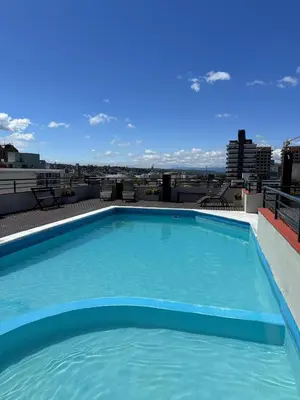 a large swimming pool on the roof of a building at Guten Morgen VCP in Villa Carlos Paz