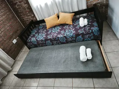 a couch with two pairs of white socks on it at Departamento Villa Cabrera in Cordoba