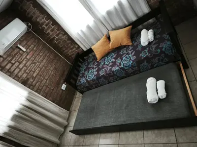 an overhead view of a bedroom with a bed and white socks at Departamento Villa Cabrera in Cordoba