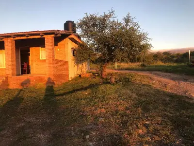 an old brick house on the side of a road at Casita El Mirador Trasla in Arroyo de Los Patos
