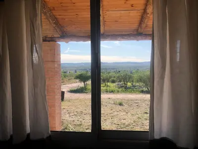 a window in a room with a view of a field at Casita El Mirador Trasla in Arroyo de Los Patos