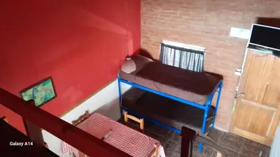 a doll house with a bunk bed in a room at Don Pinelli dptos in Alpa Corral