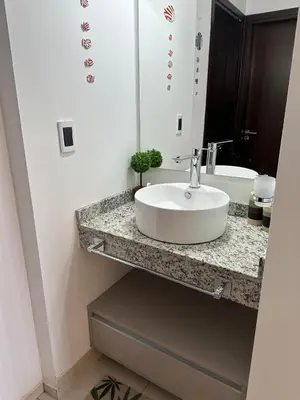 a bathroom with a white sink and a mirror at Casa de Mary in Villa Carlos Paz