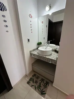 a bathroom with a sink and a mirror at Casa de Mary in Villa Carlos Paz