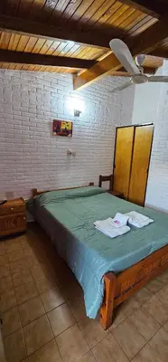 a bedroom with a large bed with towels on it at Hotel Francesco in Mina Clavero
