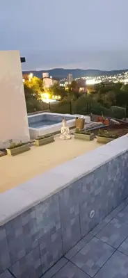a view from the roof of a building with a pool at Anima Lodge 2 in Villa Carlos Paz