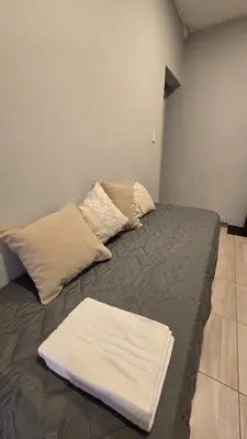 a bed with two pillows on it in a room at Las Nalichas in Villa Carlos Paz