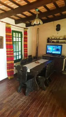 a room with a table and chairs and a television at Mountain house in Costa Blanca in Cuesta Blanca