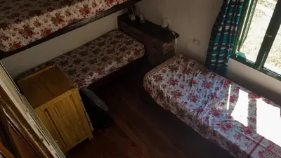 a small bedroom with two beds and a window at Mountain house in Costa Blanca in Cuesta Blanca