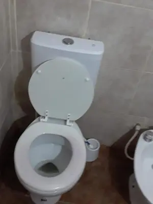 a bathroom with a white toilet in a room at El Dpto de Gabicito V in Cordoba