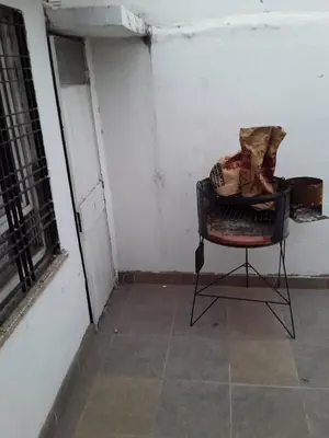 a chair sitting in a room next to a window at El Dpto de Gabicito V in Cordoba