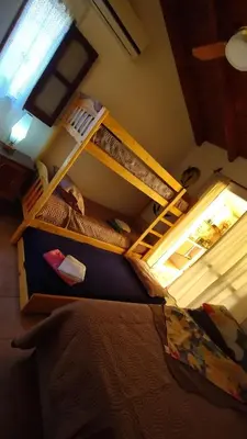 two bunk beds in a room with a window at El Rincón de Siquiman in Villa Parque Siquiman