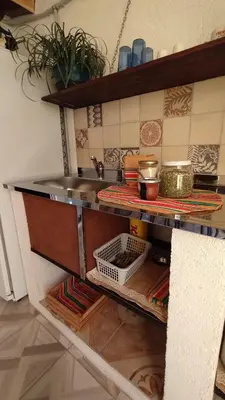 a kitchen with a sink and a counter top at El Rincón de Siquiman in Villa Parque Siquiman