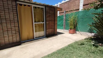 a patio with a window and a fence at El Rincón de Siquiman in Villa Parque Siquiman
