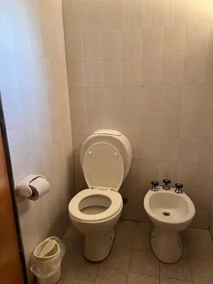 a bathroom with a toilet and a bidet at Casita de campo in Villa Ciudad Parque