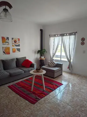 a living room with a couch and a table at Luna Vallista House in Mina Clavero