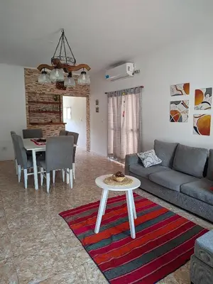 a living room with a couch and a table at Luna Vallista House in Mina Clavero