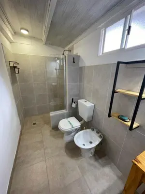 a bathroom with a toilet and a sink at Lo del Turco in La Porteña