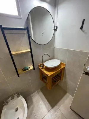 a bathroom with a sink and a mirror and a toilet at Lo del Turco in La Porteña