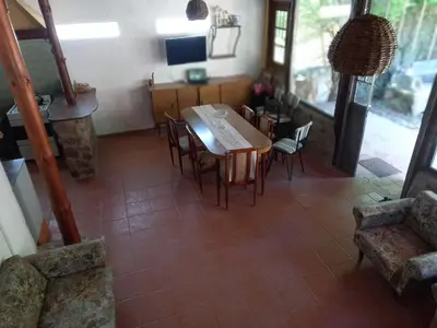 a kitchen and dining room with a table and chairs at Casa Amueblada en Las Albahacas in Piedras Blancas