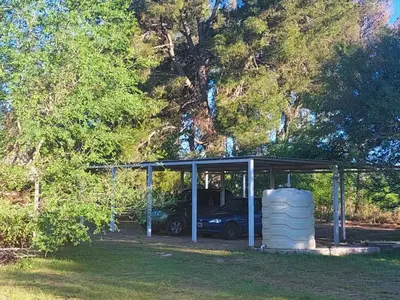 a garage with a car parked inside of it at Bosquemolinos in Villa Los Molinos