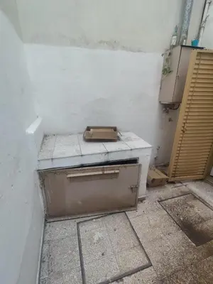 a dirty room with a stove in a wall at San Jerónimo Residential Apartaments in Cordoba