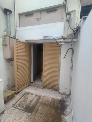 a garage with a door open in a building at San Jerónimo Residential Apartaments in Cordoba