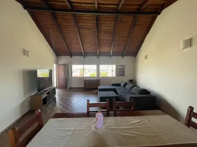 a living room with a couch and a table with a bottle on it at La Casa de la Colina in Cordoba