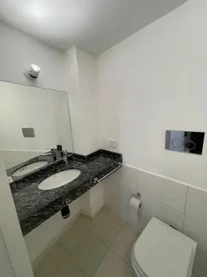 a bathroom with a sink and a toilet at La Casa de la Colina in Cordoba
