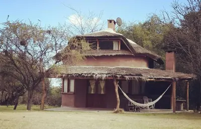 an old house with a grass roof at Cabañas Bendita Tierra- Crespin in Los Molles