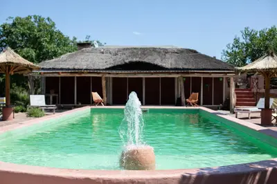 a fountain in the middle of a swimming pool at Cabañas Bendita Tierra- Crespin in Los Molles