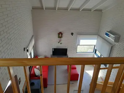 an overhead view of a room with a desk in a building at Aire Serrano in Los Reartes