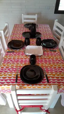 a table with plates and utensils on top at Aire Serrano in Los Reartes