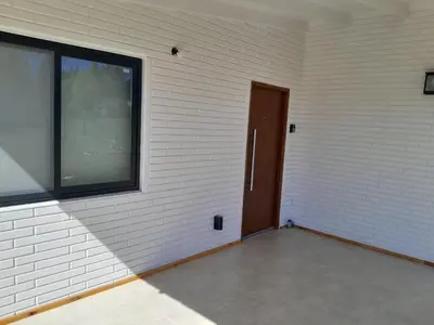 a empty room with a door and a window at Aire Serrano in Los Reartes