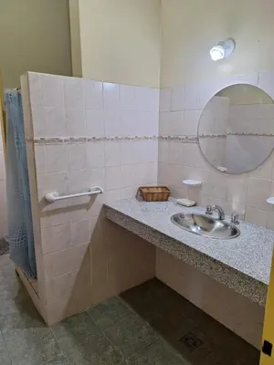 a bathroom with a sink and a mirror at sukkah in Santa Rosa de Calamuchita
