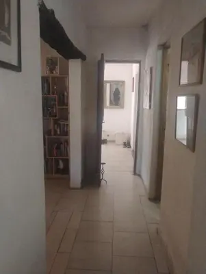 a hallway of a house with a tile floor at Casa de campo con pileta in Alta Gracia